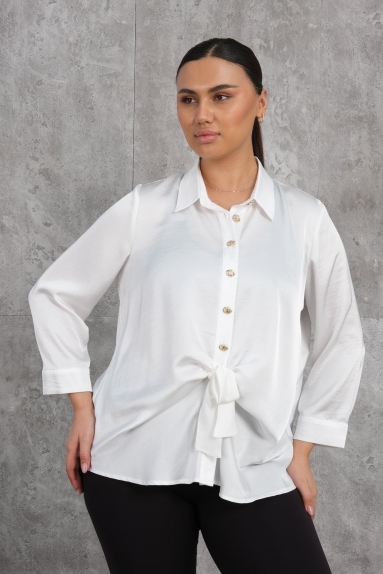  This plus-size womens blouse combines elegance and comfort with its stylish design. Its white color makes it suitable for any combination, while the buttons and tie details on the front add a modern look. Available in four different sizes (42, 44, 46, 48) to fit every body type. The fabric composition is 65% cotton, 30% polyester, and 5% elastane, making the blouse both lightweight and flexible.