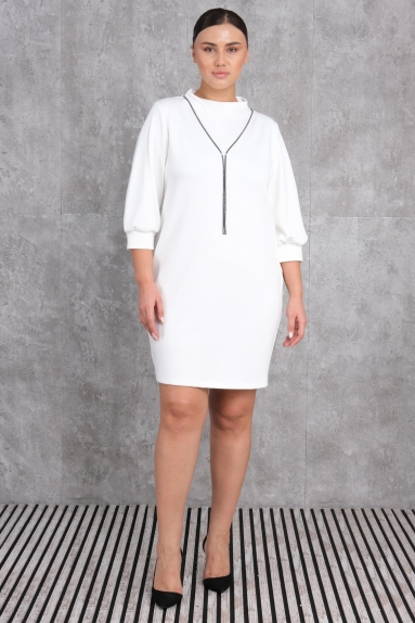  This plus-size womens dress features a chic and elegant design in a stunning white color. The dress is available in sizes 42, 44, 46, and 48, each offering a perfect fit. The fabric composition is 75% Polyester, 20% Cotton, and 5% Lycra, making the dress both durable and flexible. The front of the dress boasts a minimalist necklace detail, while the back has a sleek, straight cut. The three-quarter length balloon sleeves add a touch of elegance to the overall look.