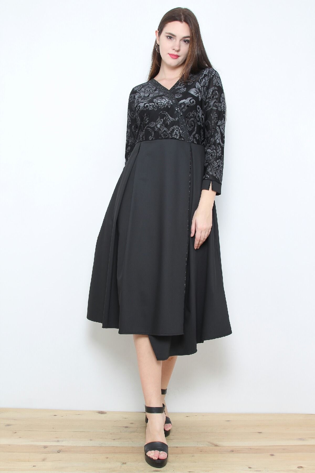 Dress with lace detail and asymmetric bottom