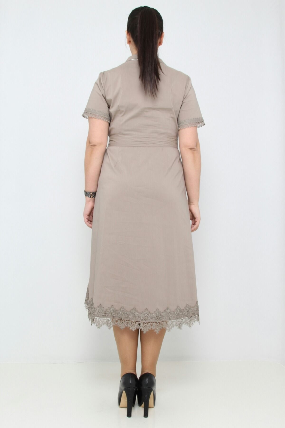Dress with lace detail and asymmetric bottom